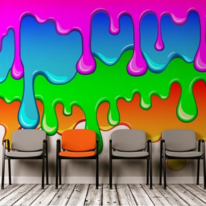 May include: Four chairs in a waiting room with a colorful abstract wall mural. The chairs are gray except for the one in the middle, which is orange.
