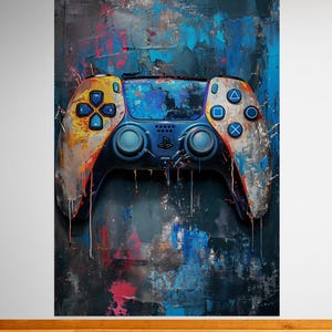 May include: A blue, yellow, and white video game controller with a paint splatter effect on a blue, gray, and red abstract background.