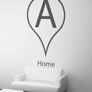 May include: A black and white graphic of a map pin with the letter "A" inside the circle and the word "Home" underneath.