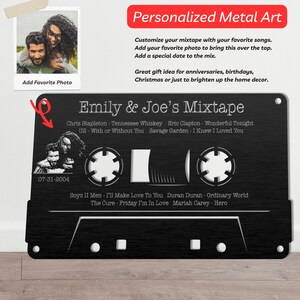 May include: Black metal cassette tape design with a photo placeholder, a date, and a list of song titles. The text reads "Emily & Joe's Mixtape".
