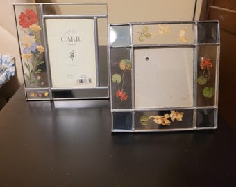 Vintage stained glass frames featuring delicate pressed flowers embedded in the glass
