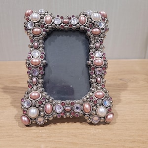 Belle Maison silver frame is decorated with hand-set pink crystals and faux pearls.