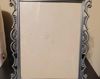 Vintage Weston Gallery silver metal ornate picture frame with detailed, scroll-like vine design.