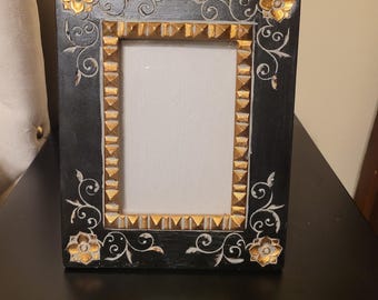 Vintage-style black wooden photo frame with gold floral carvings
