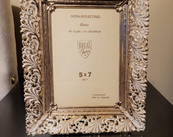 Vintage 5x7 Regal Frame features an ornate, filigree-style metal design in a white-washed gold finish