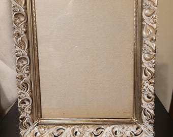 Vintage antique heavy, ornate frame with filigree design with floral and scrollwork detailing