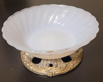 Vintage milk glass trinket or soap dish with a gold-colored metal base.