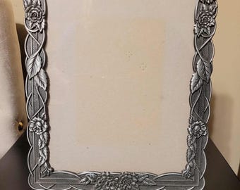 Vintage pewter photo frame featuring an ornate rose and vine motif