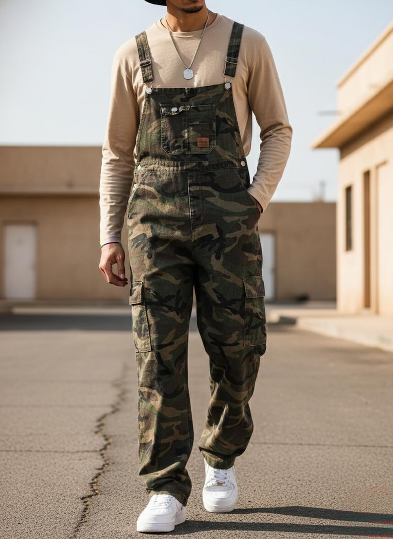 Men's slim-fit camouflage denim bib overalls with adjustable shoulder straps and multiple pockets in an urban streetwear design