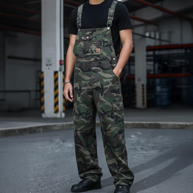 Men's slim-fit camouflage denim bib overalls with adjustable shoulder straps and multiple pockets in an urban streetwear design