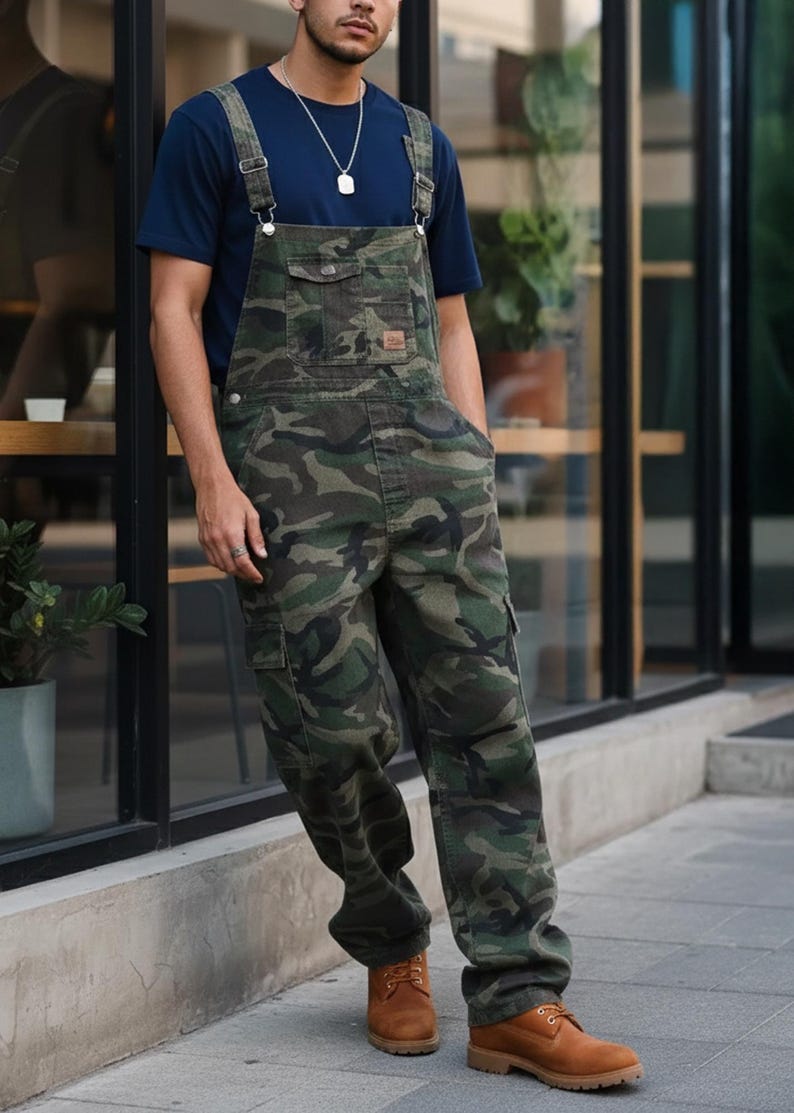 Men's slim-fit camouflage denim bib overalls with adjustable shoulder straps and multiple pockets in an urban streetwear design