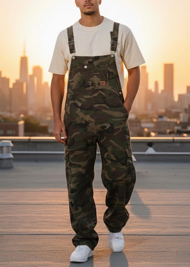 Men's slim-fit camouflage denim bib overalls with adjustable shoulder straps and multiple pockets in an urban streetwear design