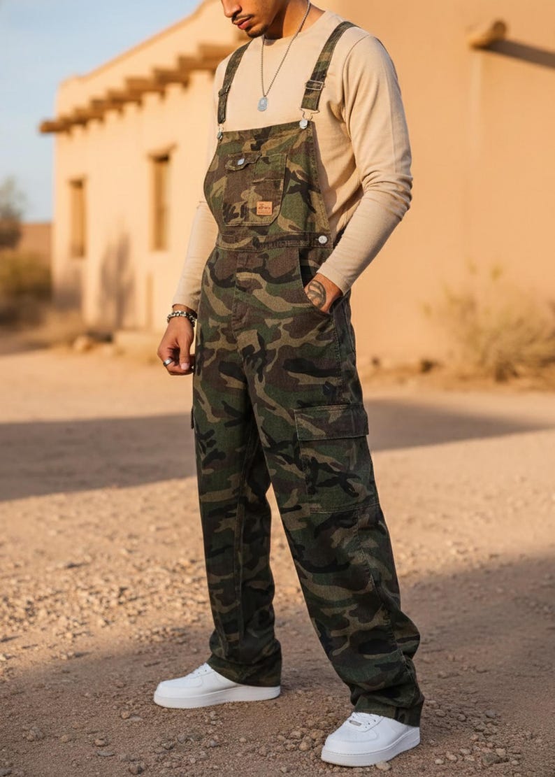 Men's slim-fit camouflage denim bib overalls with adjustable shoulder straps and multiple pockets in an urban streetwear design