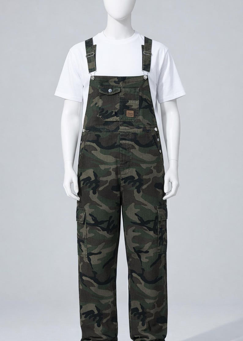 Men's slim-fit camouflage denim bib overalls with adjustable shoulder straps and multiple pockets in an urban streetwear design