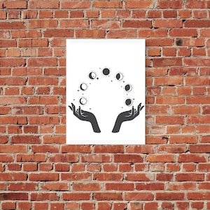 May include: A black and white illustration of two hands holding a circle of moon phases. The moon phases are in various stages of fullness, from new moon to full moon.