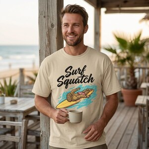 Surf Squatch Unisex T-shirt, Surf Squatch Bigfoot Surfer, Funny Sasquatch Beach Vacation Shirt, Surfing Cryptid Summer Vibes