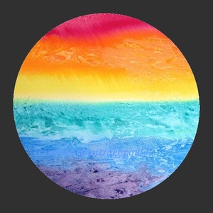May include: A circular watercolor painting with a rainbow gradient. The top half of the circle is a vibrant red, orange, and yellow. The bottom half is a cool blue, green, and purple.