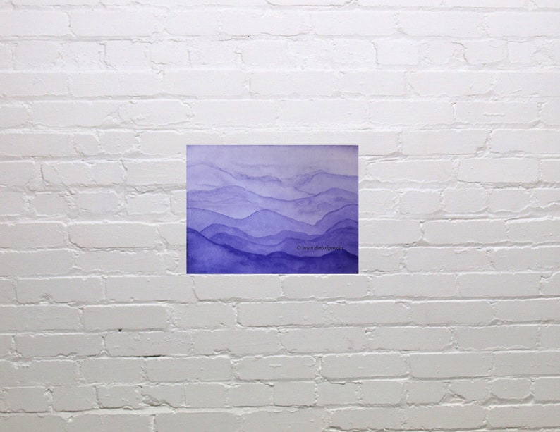 May include: Watercolor painting of a purple mountain range with a light blue sky. The painting is on a white background.