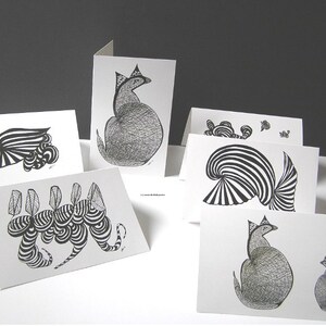 May include: Set of six black and white greeting cards featuring abstract designs. The cards are blank inside and perfect for sending a personalized message.