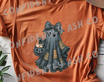 May include: Orange t-shirt featuring a Halloween ghost design. The ghost is wearing a denim outfit with patches and a bow, carrying a jack-o'-lantern bucket. The words "DIGITAL PRODUCT" are printed on the bottom left.