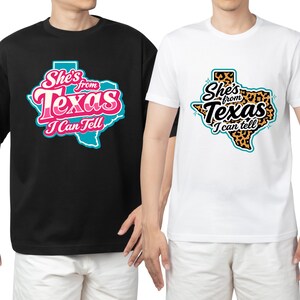 May include: Two t-shirts, one black and one white, each with a Texas state graphic. The black shirt's graphic is pink, teal, and white, while the white shirt has a leopard print design. Both shirts display the text "She's from Texas I Can Tell".