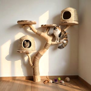 May include: A cat tree constructed from natural wood branches with sisal rope wrapping, featuring two woven grass hideaways and multiple flat wooden platforms. A calico cat sits on a branch, while a tabby cat rests inside a lower hideaway.