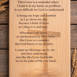 May include: Wooden plaque with the text "The Cross in My Hand" and a cross design. The text is a religious poem about faith and prayer. The plaque is light brown with a wood grain texture.