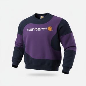 Puede incluir: Una sudadera Carhartt en azul marino y morado. La sudadera presenta el nombre de la marca en blanco en el pecho, con un logotipo naranja. Las mangas y la parte superior son azul marino, mientras que el centro es morado.