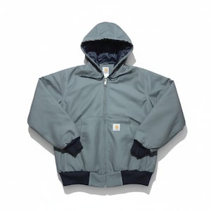 May include: A hooded, zip-up work jacket in a muted teal color. The jacket features a dark navy blue lining in the hood and cuffs, and a small logo patch on the chest. The jacket has two front pockets and a ribbed hem.