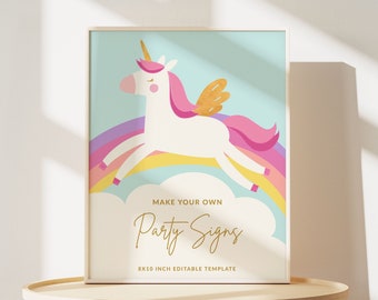 May include: A framed print with a cartoon unicorn, pink mane and tail, gold wings, and a golden horn, jumping over a rainbow. The text "MAKE YOUR OWN PARTY SIGNS" is in gold script, with "8x10 INCH EDITABLE TEMPLATE" below. The frame is 20.32 x 25.4 cm.