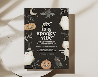 May include: A black and white printable invitation for a child's 6th birthday party. The invitation features a spooky theme with a ghost, a bat, a mummy, a pumpkin, and a black cat. The text on the invitation reads "six is a spooky vibe" and includes details about the party, such as the date, time, and location.