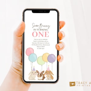 May include: A digital invitation for a first birthday party with a bunny theme. The invitation features a pink, yellow, and blue balloon bouquet, two bunnies wearing party hats, and the text "Some Bunny is Turning One". The invitation also includes the date, time, and location of the party.