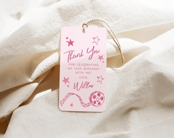 May include: Pink thank you tag with a film reel design and stars. The text reads "Thank You for celebrating my 14th birthday with me! Love, Willow."