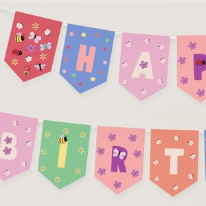 May include: A colorful banner spelling out "HAPPY BIRTHDAY" with individual pennants. Each pennant is a different color, featuring letters, flowers, and insects. The banner is strung on a white string, perfect for a birthday celebration.