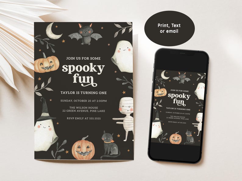 May include: A black and white Halloween party invitation with a spooky theme. The invitation features a ghost, a bat, a mummy, a pumpkin, and a cat. The text on the invitation reads "Join us for some spooky fun. Taylor is turning one. Sunday, October 20 at 2:00pm. The Wilson House, 22 Green Avenue, Pine Lake. RSVP Emily at 555-5555."