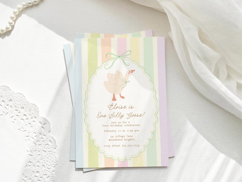 May include: A pastel-colored invitation card with a striped background. The card features a cartoon illustration of a white goose with a pink bow. The text on the card reads "Eloise is One Silly Goose!" and includes details for a first birthday celebration.
