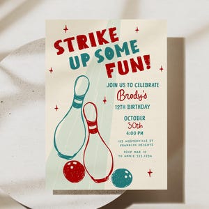 May include: Birthday party invitation with a bowling theme. The text "STRIKE UP SOME FUN!" is in red and teal. The invitation features bowling pins, a bowling ball, and details for Brody's 12th birthday on October 30th.