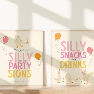 May include: Two framed party signs with a light beige background. One sign reads "Make your own SILLY PARTY SIGNS" with a cartoon goose and balloons. The other sign says "SILLY SNACKS and DRINKS" with cartoon geese and balloons. The signs are 8x10 inches.