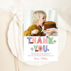 May include: A colorful thank you card with a floral design and a photo of a young child taking a bite out of a cake. The text on the card reads "THANK YOU" in large letters and "I loved the cake, and the presents too, but the best part was seeing you. Thank you for making my birthday so much fun! love, Chloe".