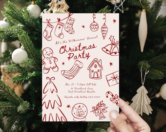 May include: A cream-colored Christmas party invitation with red illustrations of stockings, ornaments, a gingerbread man, and a candy cane. The text reads "It's the Wilkinsons' Annual Christmas Party" with the date, time, and location details.