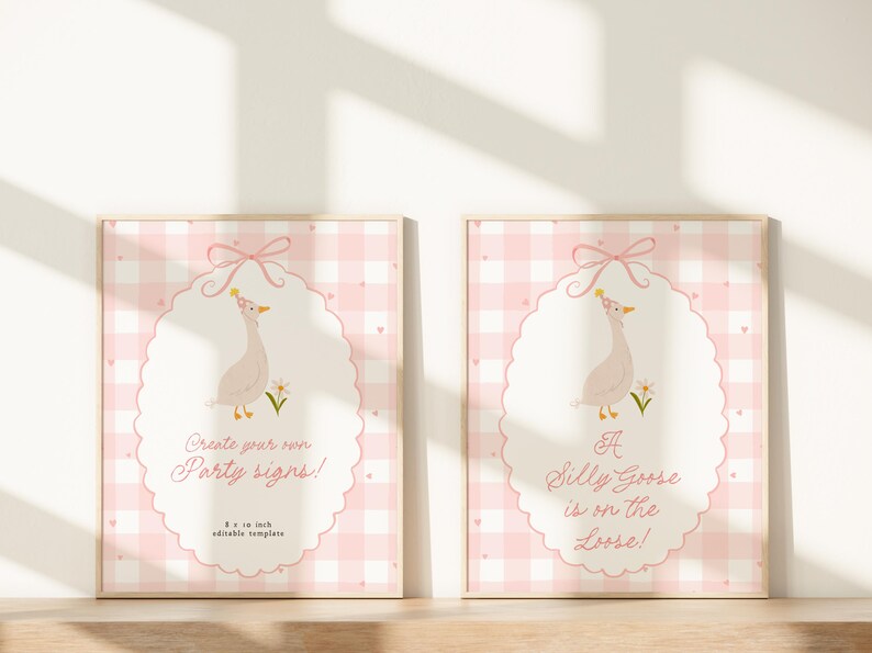 May include: Two framed prints with a pink gingham background and a white oval design. Each print features a cartoon goose wearing a party hat and the text "Create your own Party signs!" and "A Silly Goose is on the Loose!" The frames are 8 x 10 inches.