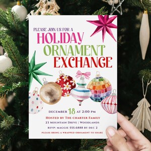 May include: A holiday ornament exchange invitation with colorful watercolor illustrations of Christmas ornaments. The invitation includes the text "HOLIDAY ORNAMENT EXCHANGE" and event details. The invitation is held in front of a Christmas tree.