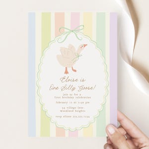 May include: A pastel-colored invitation with a striped background. The invitation features a cartoon goose with a green bow and the text "Eloise is One Silly Goose!"  Join us for a first birthday celebration, February is at 1:30 pm, 34 Village Lane, Woodland Heights, RSVP Alison 155.555.1234.