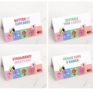 May include: Four white tent cards with colorful designs and text. Each card features a different phrase: "Butterfly Cupcakes," "Editable Food Labels," "Strawberry Shortcake," and "Veggie Cups & Ranch." The designs include bees, flowers, and insects.