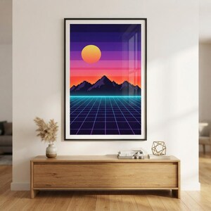 May include: A framed vertical wall art print featuring a pixel art landscape with a glowing yellow sun, purple and orange gradient sky, dark mountain silhouettes, and a blue neon grid floor extending into the distance on a dark background.