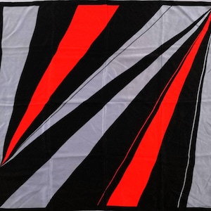 May include: Square scarf with a bold geometric design. The scarf features alternating black, gray, and vibrant red diagonal stripes. The edges are bordered with a thin black line, creating a striking visual contrast.