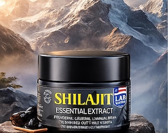 May include: Black jar of Shilajit Essential Extract with text and a small wooden spoon with dark brown pieces on a rock. The background features a mountain range.
