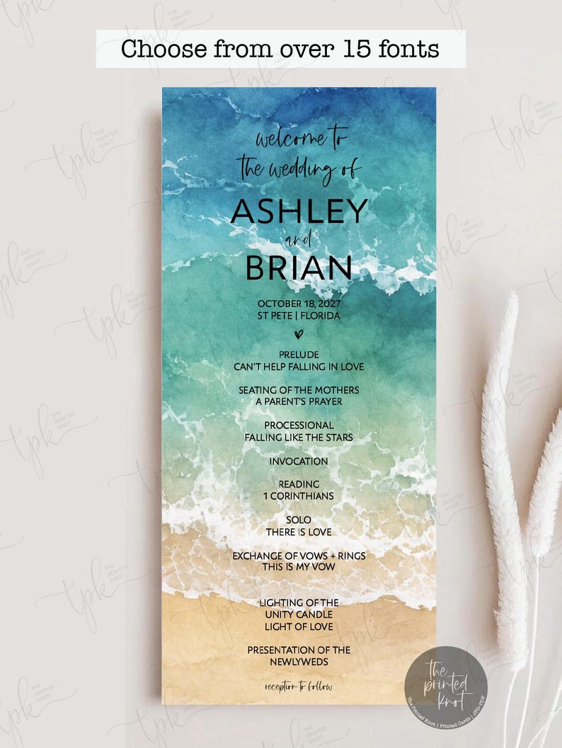 May include: A vertical wedding program card featuring a watercolor ocean wave design transitioning from deep blue to turquoise and sandy beige. The text includes the names Ashley and Brian, the date October 18, 2027, and a detailed ceremony order.