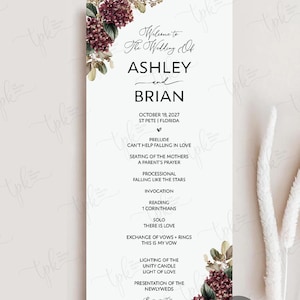 May include: A vertical wedding program card featuring dark burgundy hydrangea floral accents at the top left and bottom right corners. The text reads: Welcome to The Wedding Of ASHLEY and BRIAN, October 18, 2027, St Pete, Florida, and a full ceremony order.