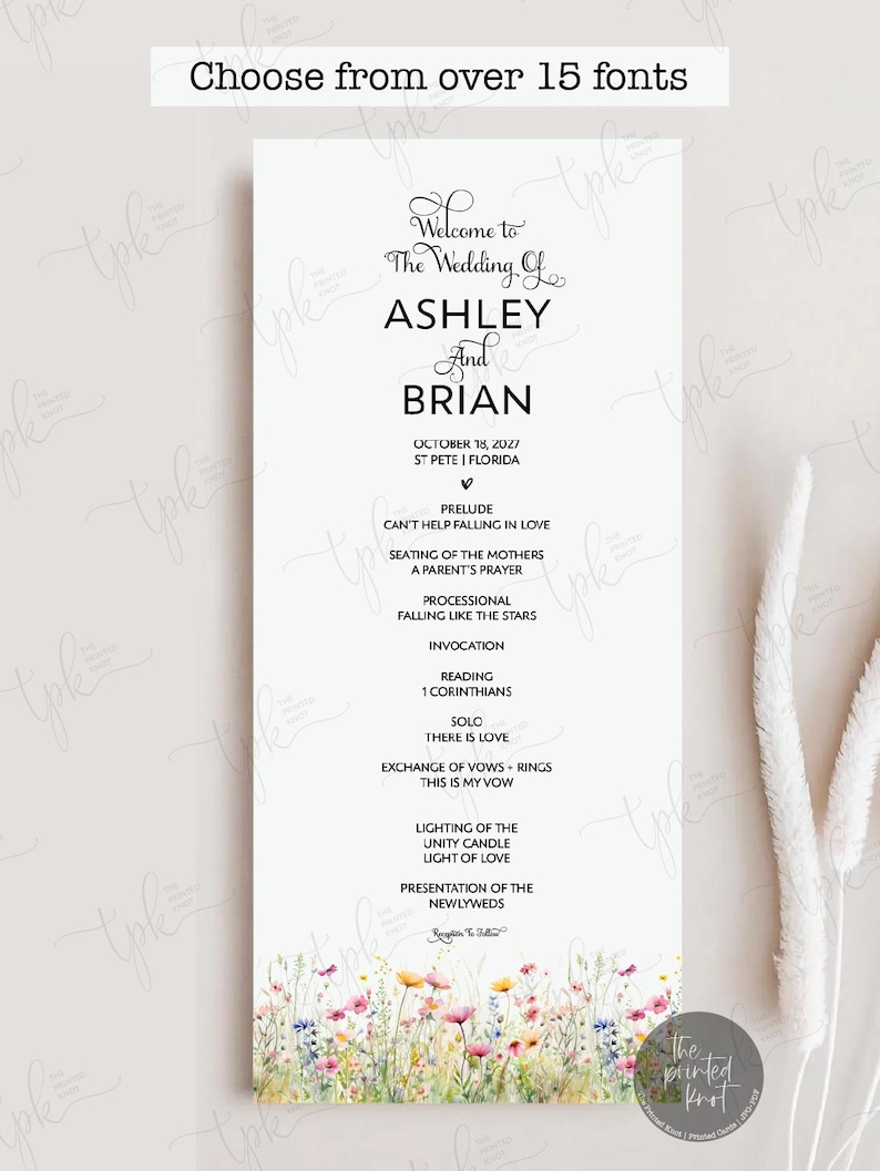 May include: A vertical white wedding programme card featuring black text detailing the ceremony order for Ashley and Brian on 18 October 2027, in St. Pete, Florida. The bottom edge is decorated with a colourful watercolour illustration of wildflowers.